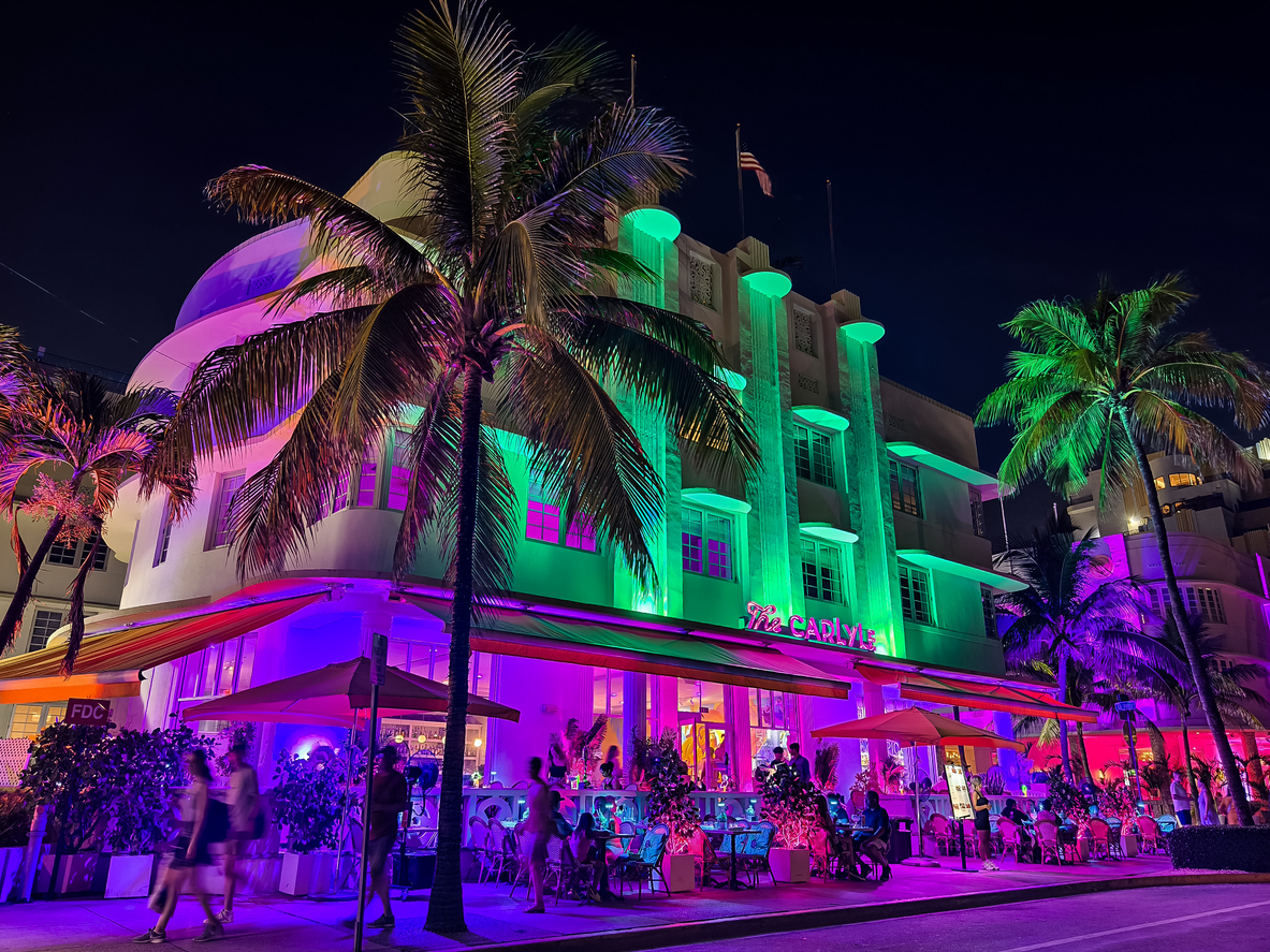 Miami Beach, Florida - Vibrant night scene of The Carlyle next to Miami Art Basel.